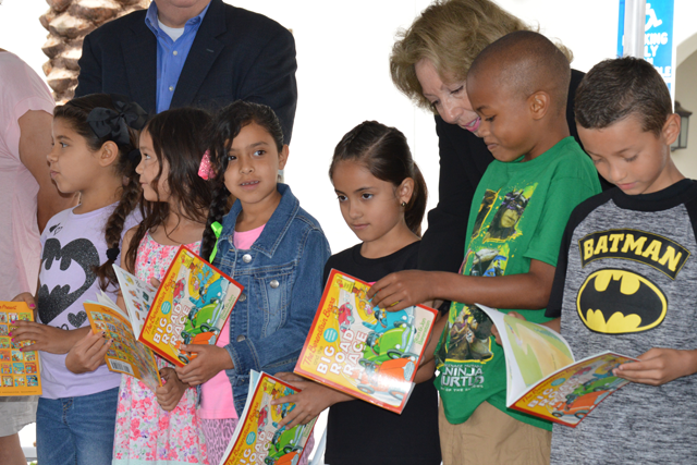 Supervisor Josie Gonzales with children at the Bloomington Library Grand Opening